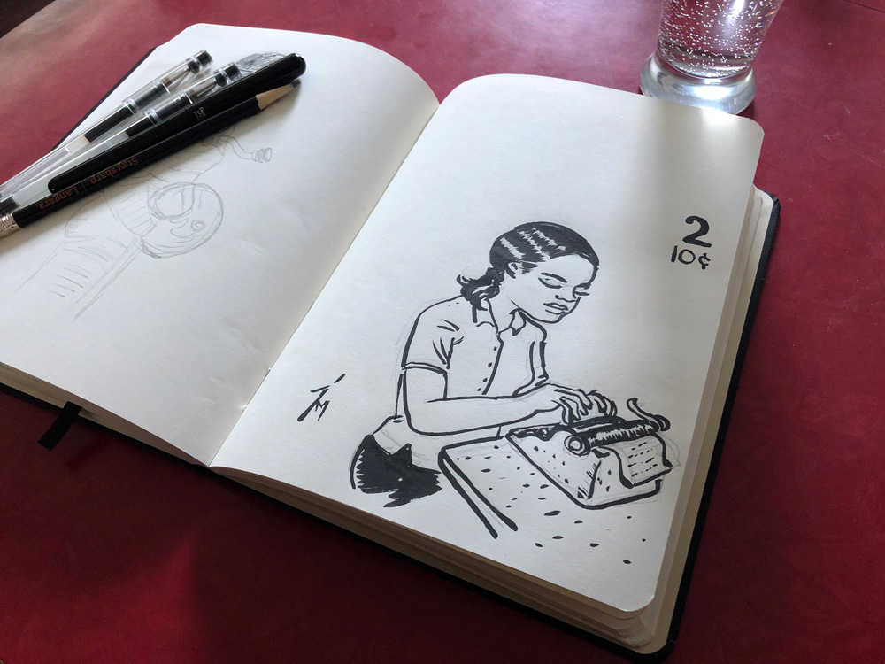 Photo of a sketchbook on a table.
