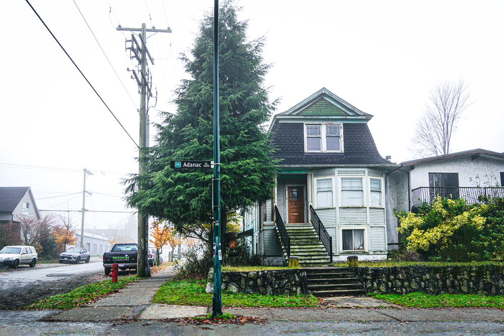 Photo of old house on a quiet street.