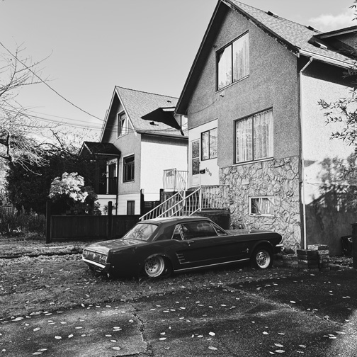 black and white photo of an old muscle car.