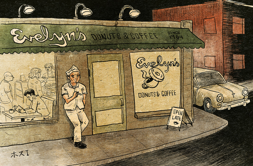 Image of a cook taking a break in front of a coffee shop.