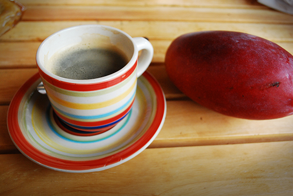 having a mango and coffee in El Salvador, Central America.