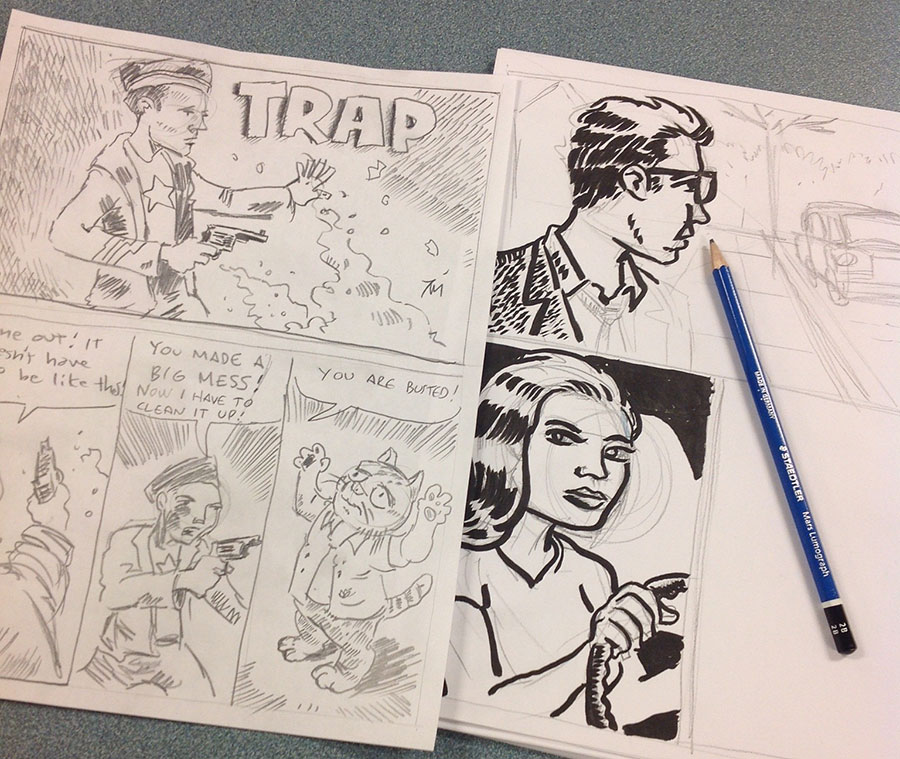 Photo of pencil drawings on the table.